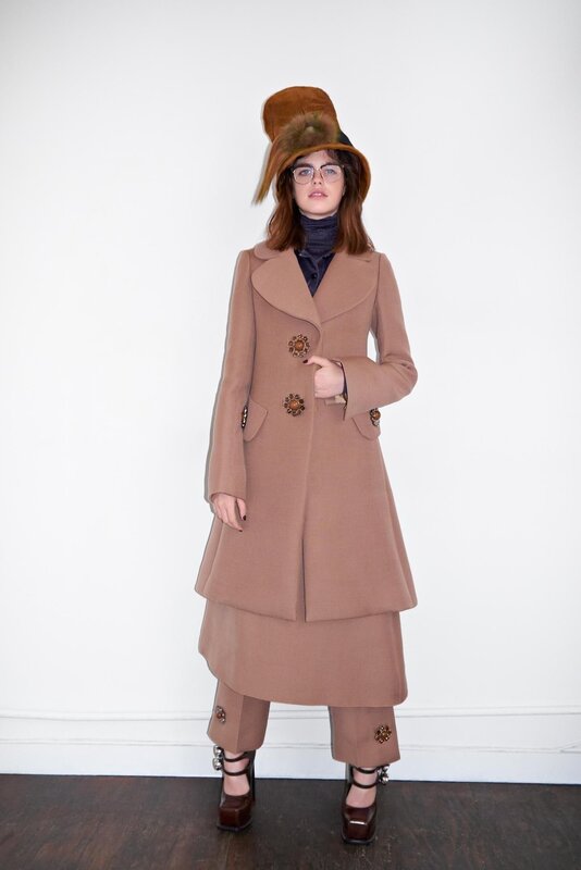 woman in brown coat and hat