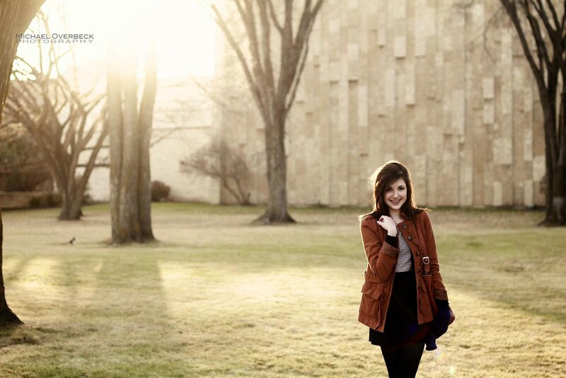woman in brown coat smiling