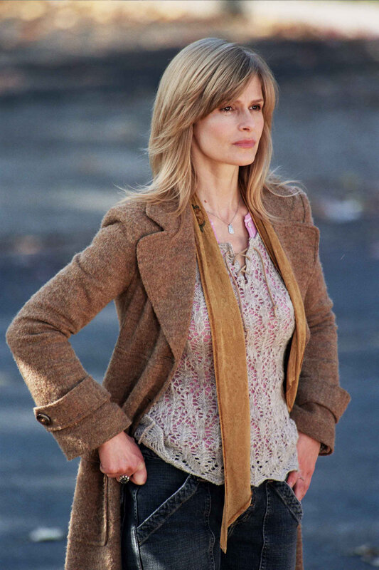 woman in brown coat standing