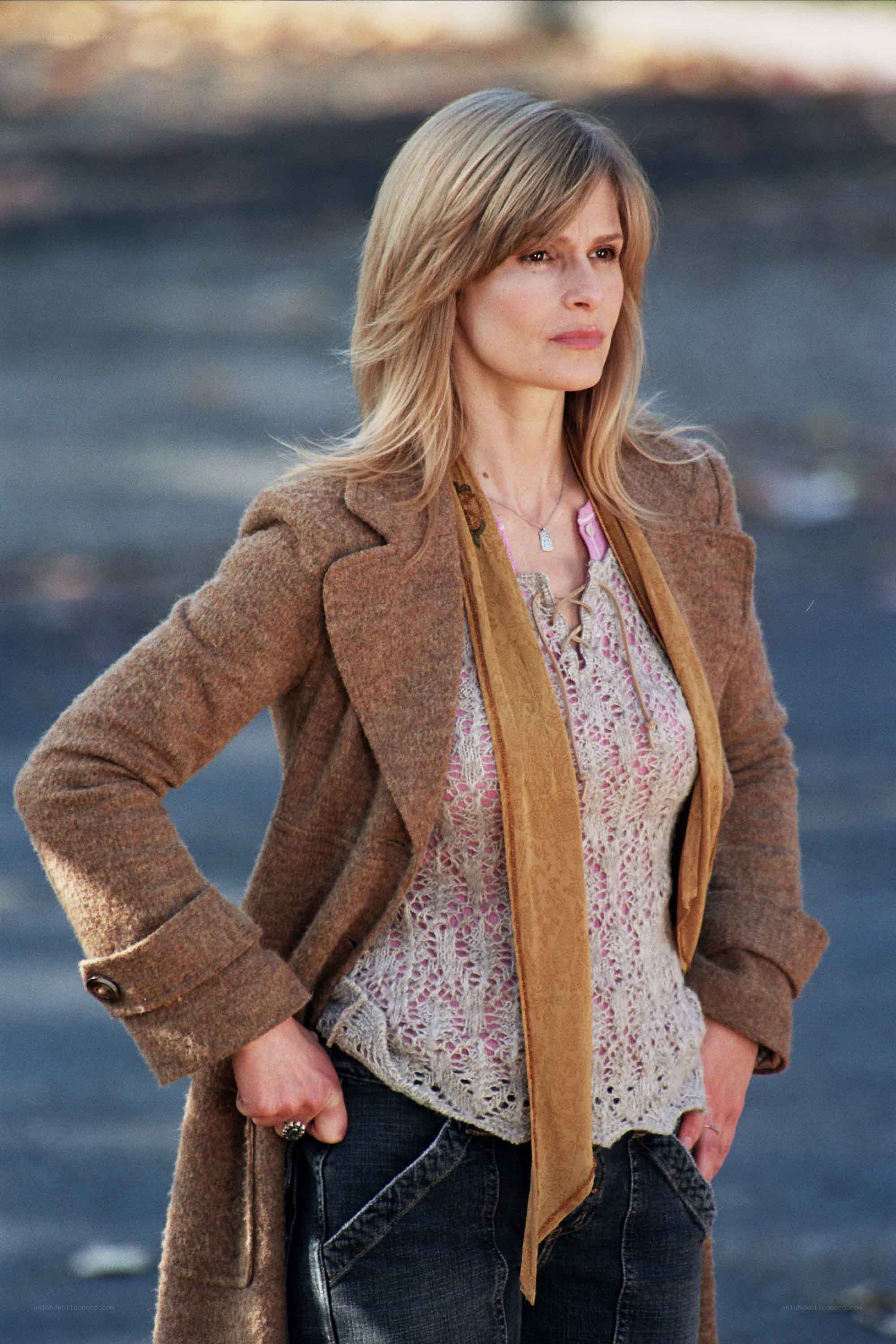 woman in brown coat standing