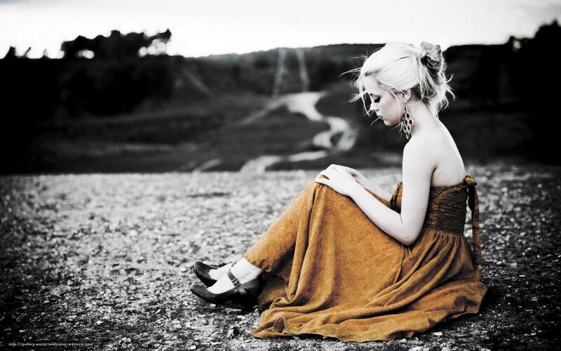 woman in brown dress sitting