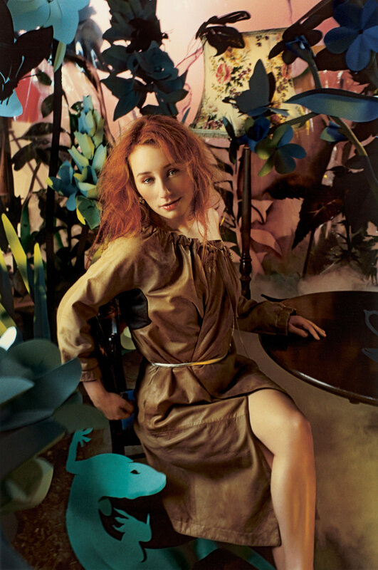 woman in brown dress with paper plants
