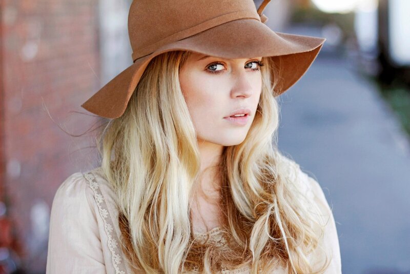 woman in brown hat