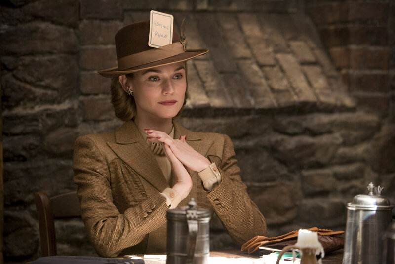 Woman in brown hat at table