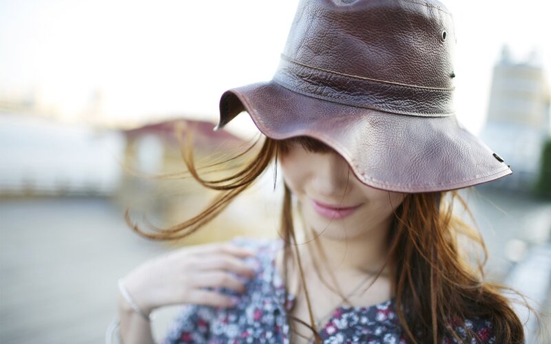 woman in brown hat outdoors