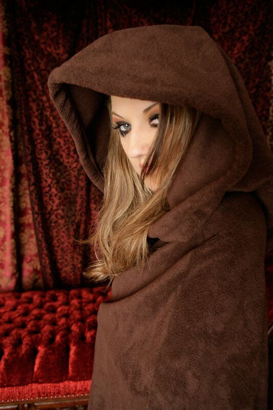 woman in brown hooded cloak