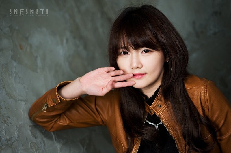 Woman in Brown Jacket — Neutral, Photograph, Hand