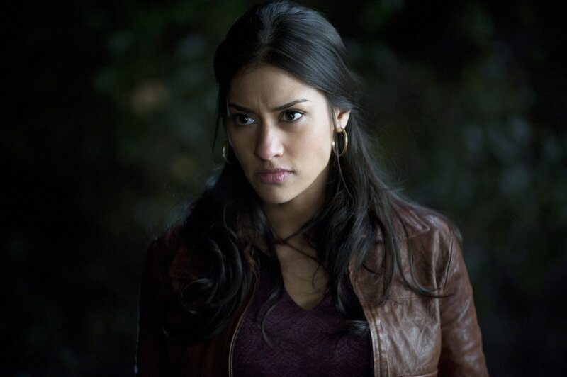 Woman in Brown Jacket — Serious, Night