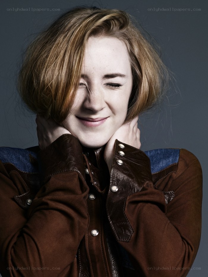 woman in brown jacket smiling