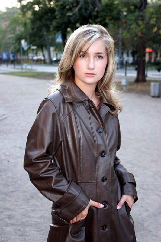 Woman in brown leather coat