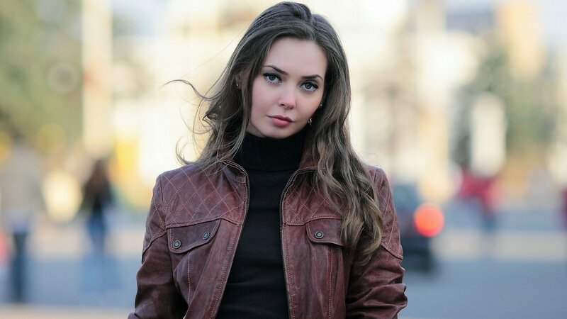 woman in brown leather jacket