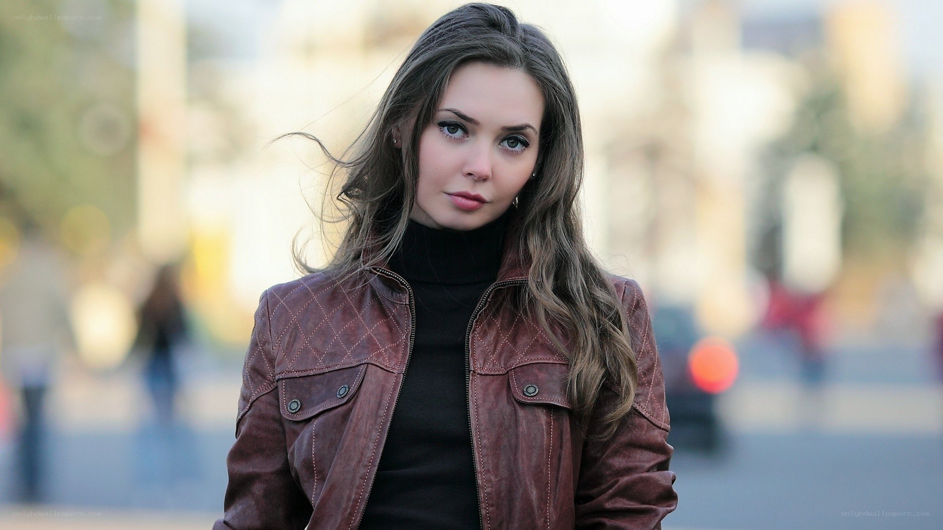 woman in brown leather jacket