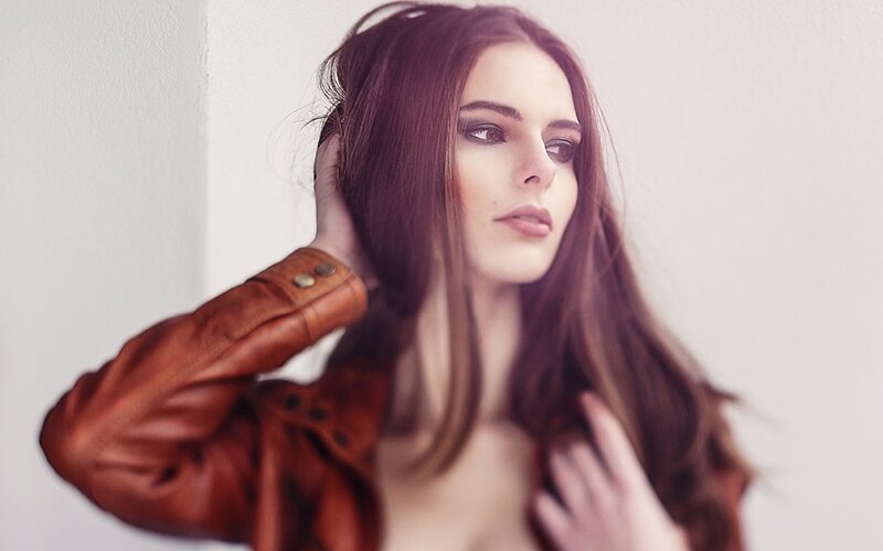 woman in brown leather jacket
