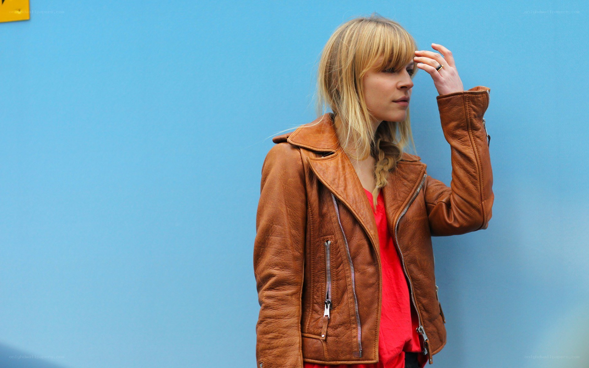 woman in brown leather jacket