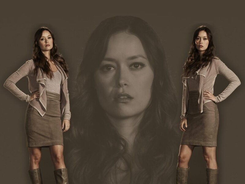 Woman in Brown Outfit — Serious