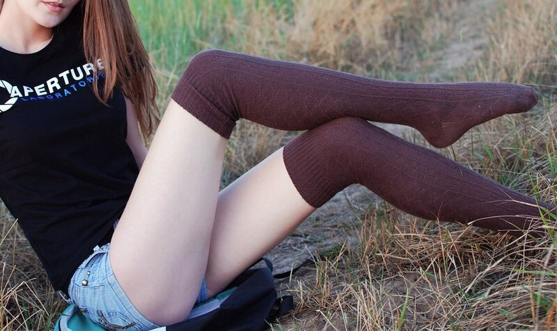 woman in brown socks sitting outdoors