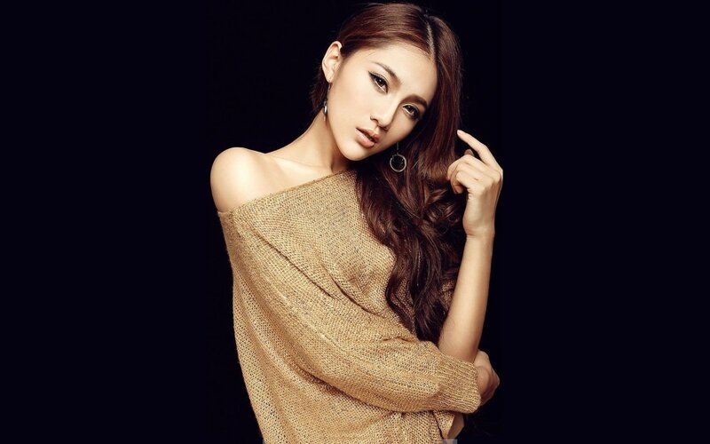 Woman in Brown Sweater — Dramatic, Photograph, Earring