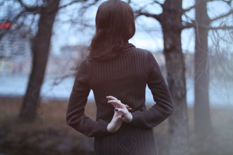 woman in brown sweater from behind