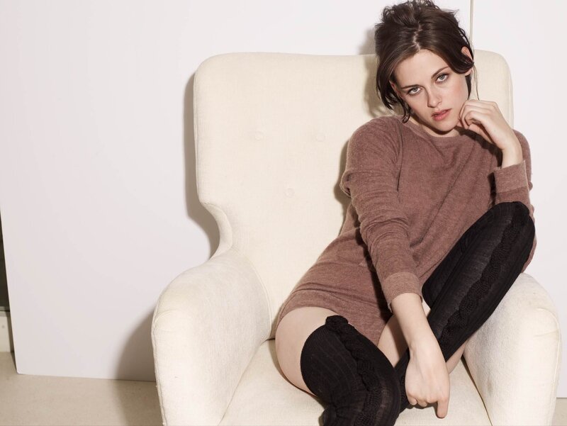 woman in brown sweater sitting