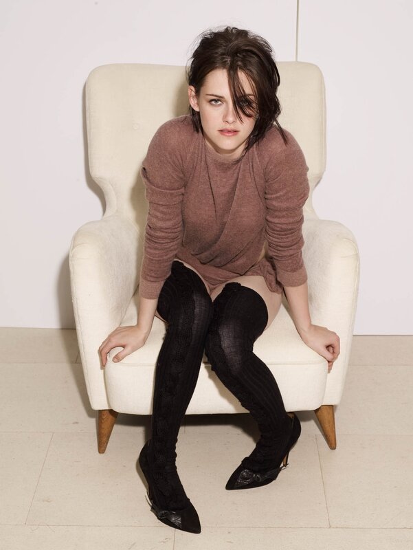 woman in brown sweater sitting
