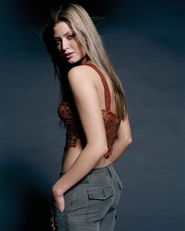 woman in brown top and jeans