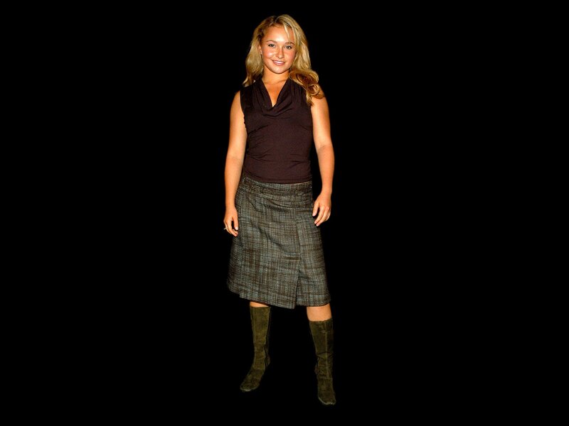 woman in brown top and plaid skirt