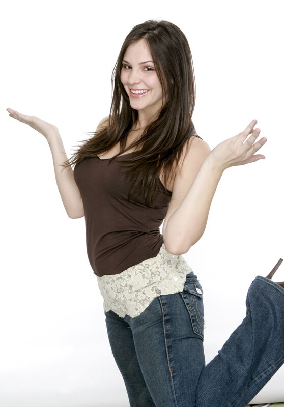 woman in brown top smiling