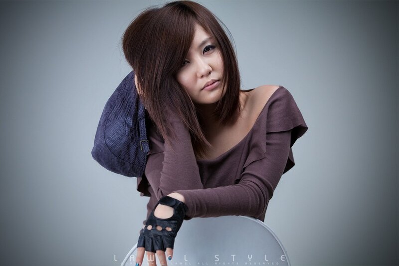 woman in brown top with bag