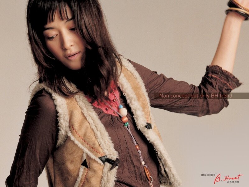 woman in brown vest