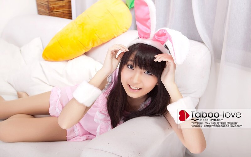 woman in bunny costume on couch