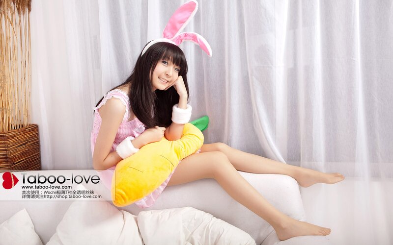 woman in bunny costume on couch