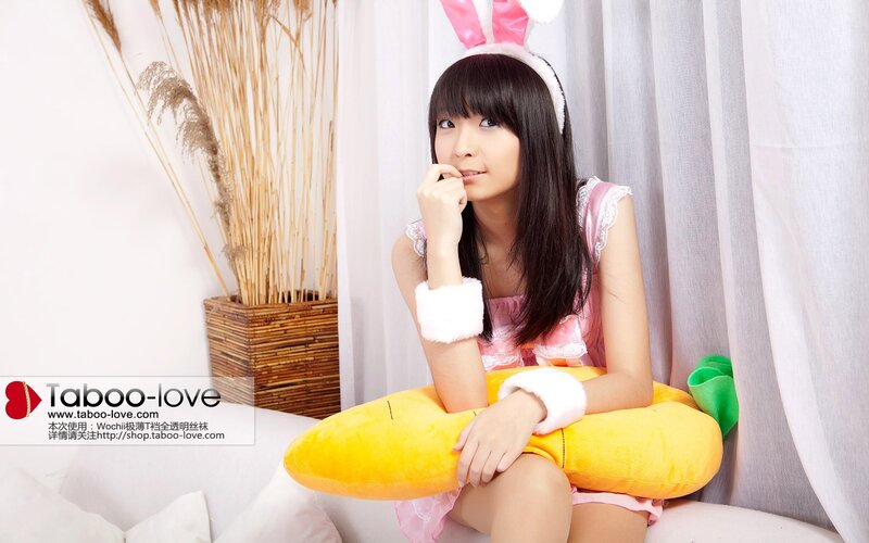 woman in bunny costume sitting