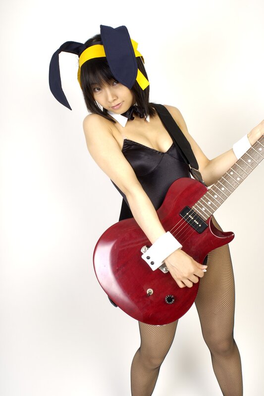 Woman in bunny costume with guitar