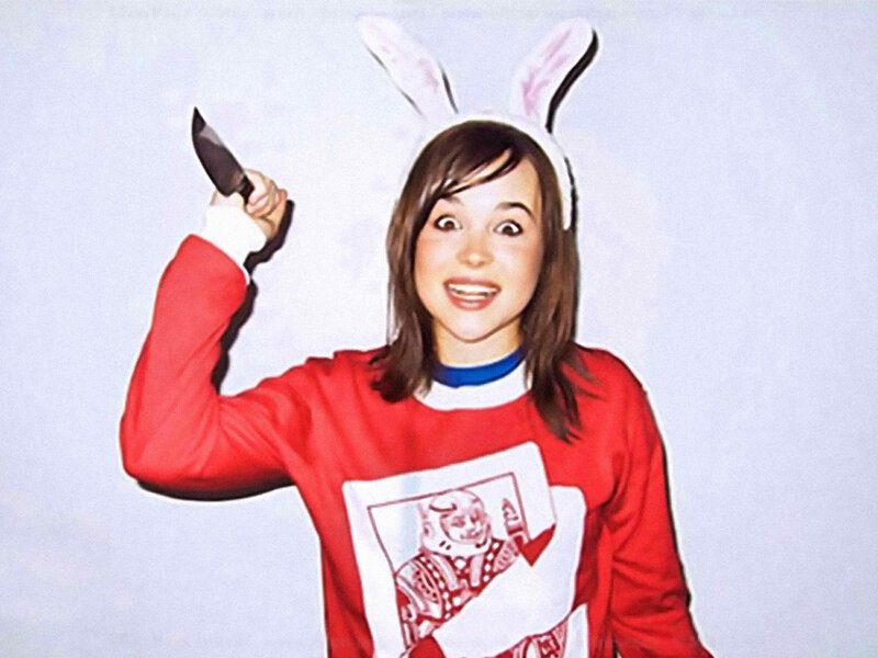 woman in bunny ears holding knife