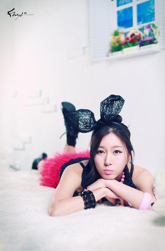 woman in bunny ears lying on floor
