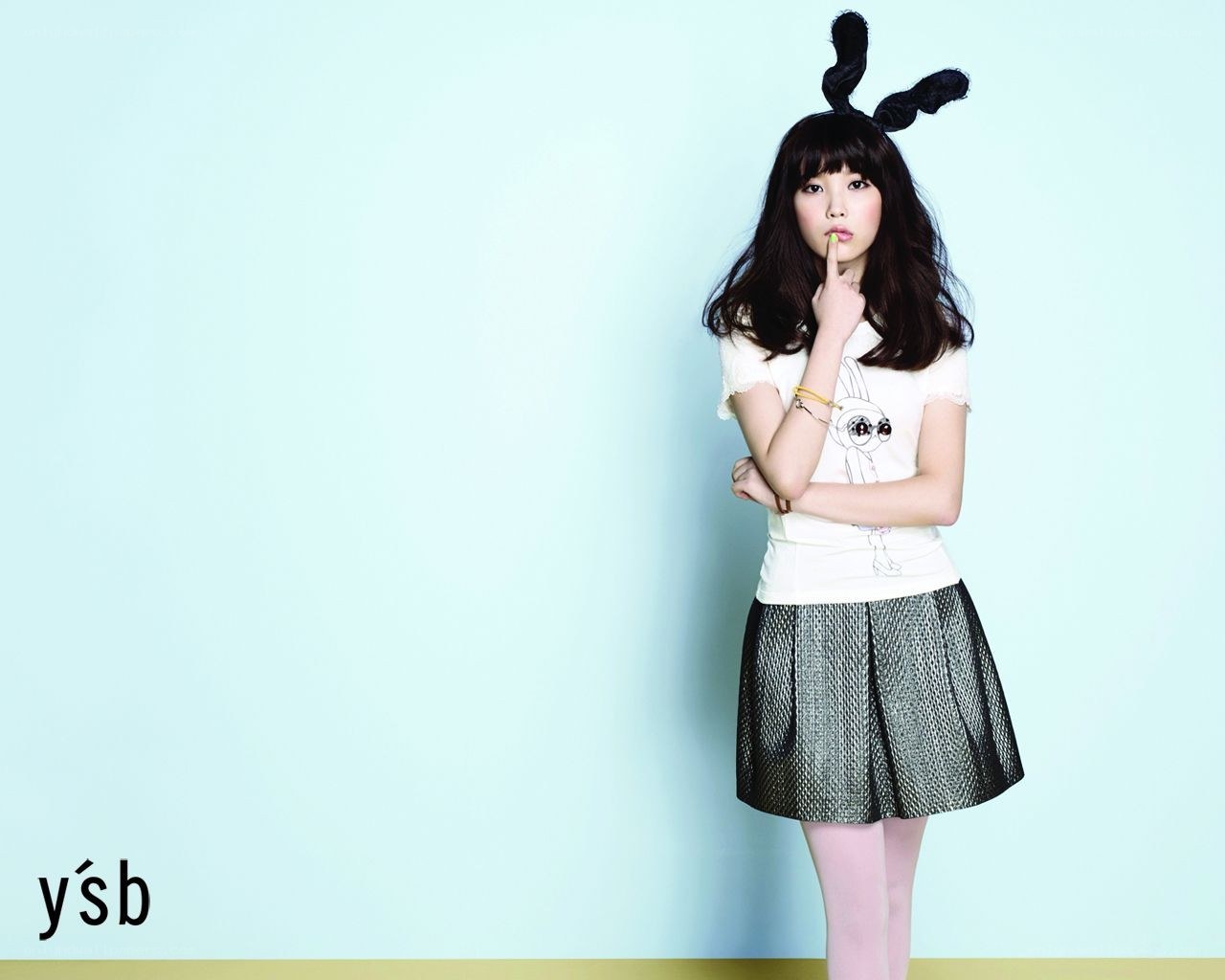 woman in bunny ears posing