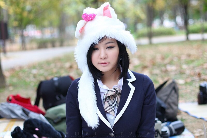 woman in bunny hat at park