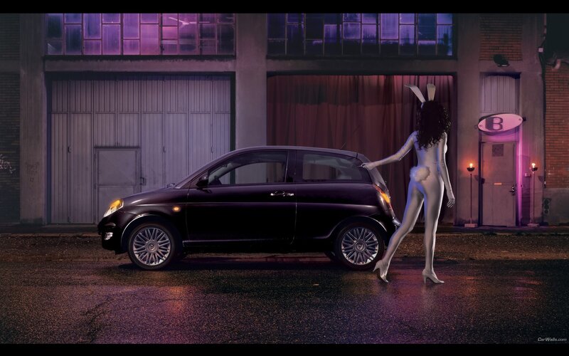 woman in bunny suit with car