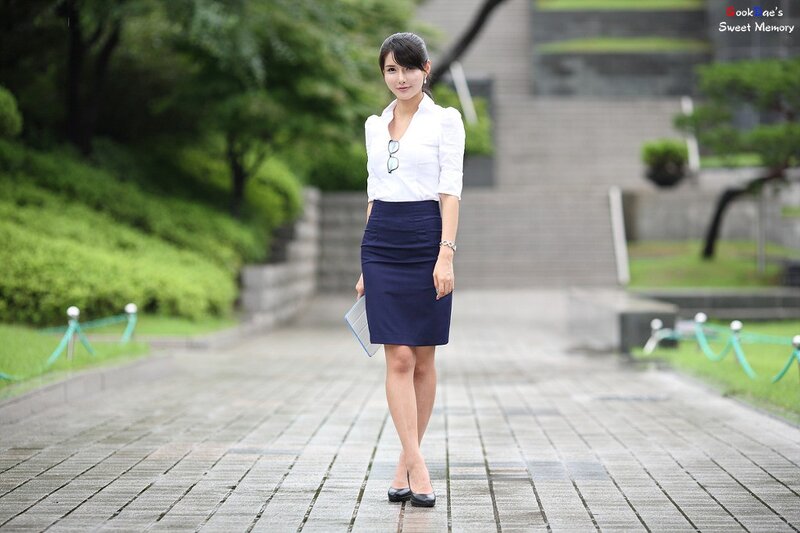 woman in business attire on a path
