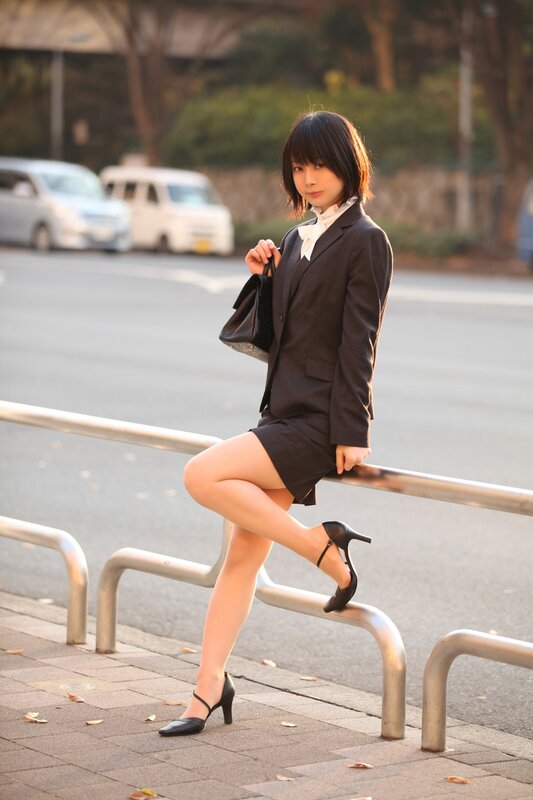 Woman in business suit on street