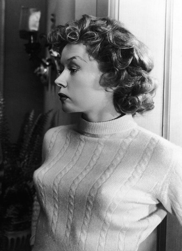 woman in cable-knit sweater