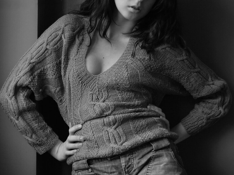 woman in cable-knit sweater