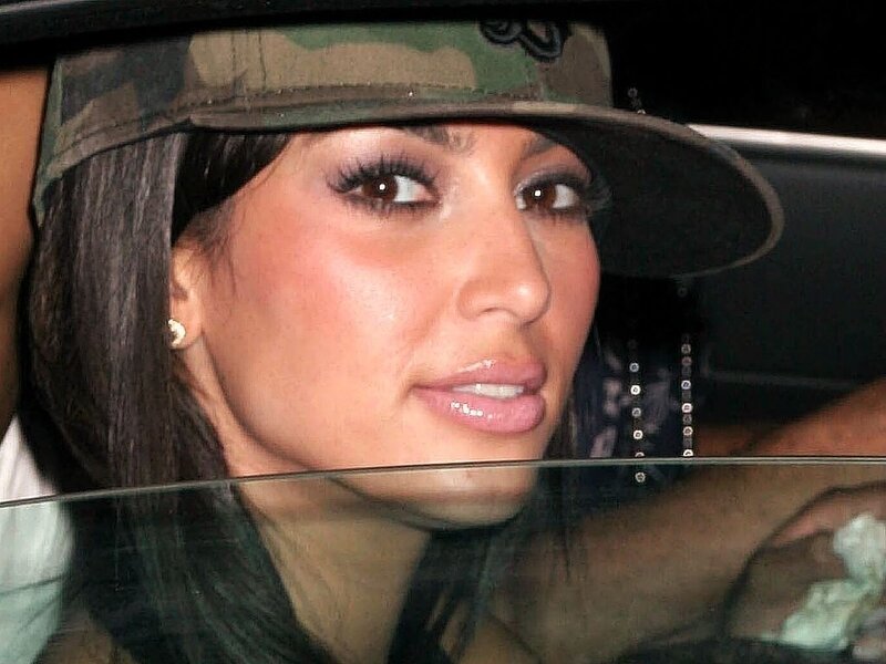 woman in camouflage hat
