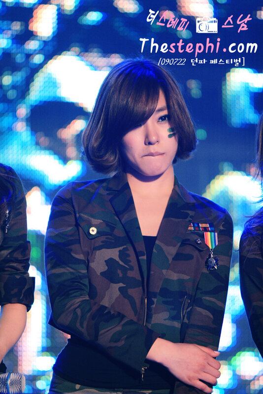 woman in camouflage jacket