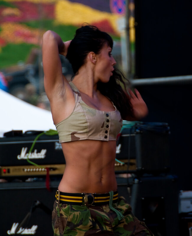 woman in camouflage outfit on stage