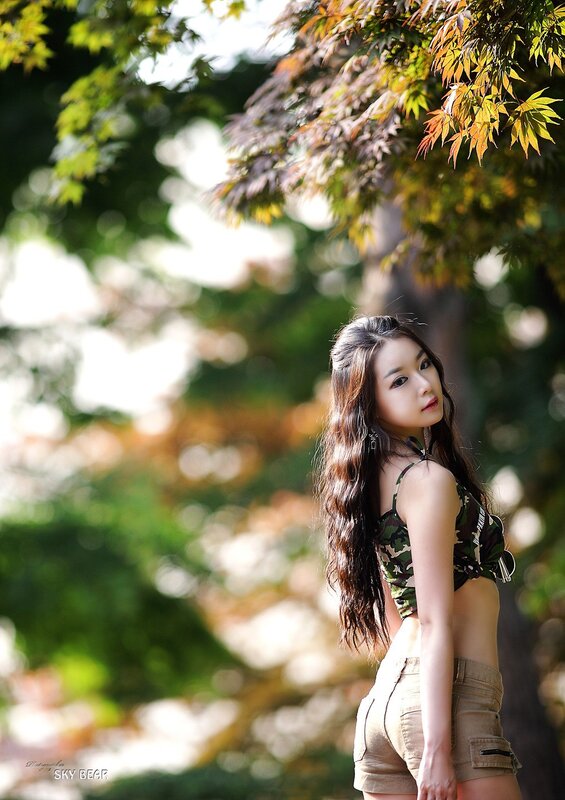 woman in camouflage top outdoors