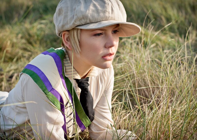 woman in cap among tall grass