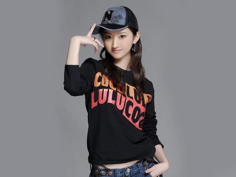woman in cap and graphic tee