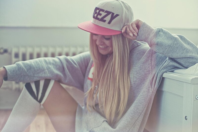 woman in cap and hoodie