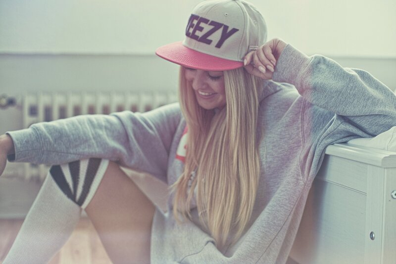 woman in cap and hoodie